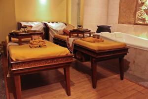 Postel nebo postele na pokoji v ubytování FUGO Hotel Banjarmasin