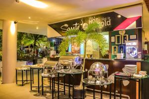 a restaurant with a bunch of glass domes on tables at FUGO Banjarmasin in Banjarmasin