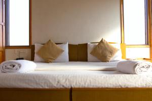 Un pat sau paturi într-o cameră la Chillout