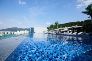 a swimming pool with blue tiles on the water at Hotel Susung Spa Resort in Daegu