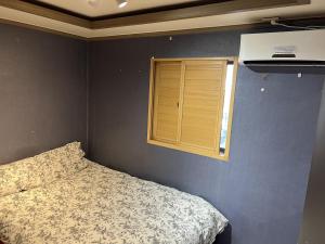Ένα ή περισσότερα κρεβάτια σε δωμάτιο στο G Mini Hotel Dongdaemun