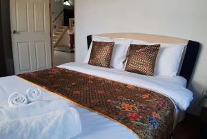 Voodi või voodid majutusasutuse Private Pattaya Resort toas