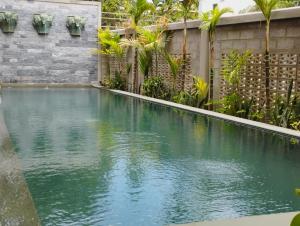 a swimming pool in the backyard of a house at Bou Savy Guesthouse in Siem Reap