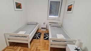 Posteľ alebo postele v izbe v ubytovaní South 2 Osijek