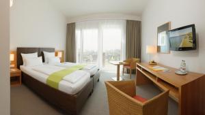 Postel nebo postele na pokoji v ubytování Hotel St Elisabeth