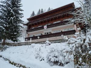 a building with snow in front of it at The Lodge at Bad Gastein in Bad Gastein