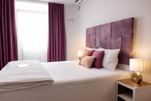 Postel nebo postele na pokoji v ubytování Hotel Bordeaux