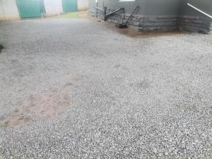 a concrete floor with a puddle of water on it at New Dawn Guest House in Brakpan