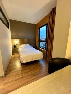 Postel nebo postele na pokoji v ubytování Hotel Duero