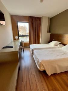Postel nebo postele na pokoji v ubytování Hotel Duero