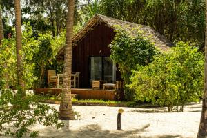 a small house in the middle of a resort at Kinazi Upepo Beach Eco Lodge in Paje