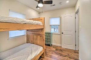 a bedroom with two bunk beds and a closet at Sunny Front Royal Vacation Rental with Hot Tub! in Front Royal