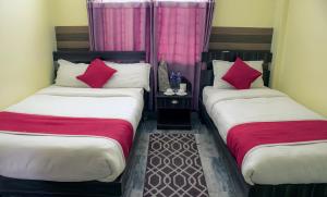 Letto o letti in una camera di Hotel Elite Pokhara