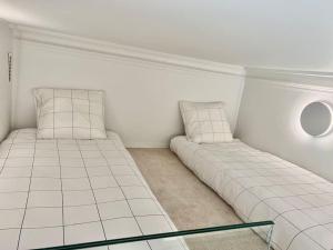 Posteľ alebo postele v izbe v ubytovaní Appartement de standing Biarritz