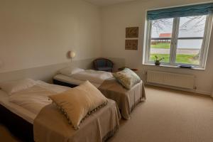 A bed or beds in a room at Borre Knob konferencecenter