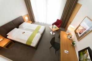 Postel nebo postele na pokoji v ubytování Hotel St Elisabeth