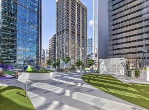 a park in a city with tall buildings at Stylish Stay for Couples in CBD by Stylish Stays in Brisbane