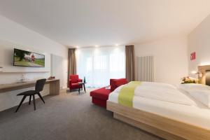 Postel nebo postele na pokoji v ubytování Hotel St Elisabeth