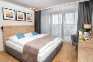 Postel nebo postele na pokoji v ubytování JUFA Hotel Neutal