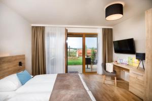 Postel nebo postele na pokoji v ubytování JUFA Hotel Neutal
