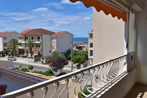 a balcony with a view of a city at Apartments Stone Tučepi in Tučepi