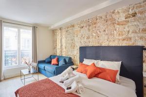 Posteľ alebo postele v izbe v ubytovaní Residence Center of Paris le Marais by Studio prestige