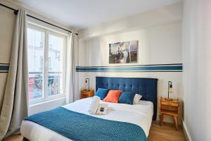 Posteľ alebo postele v izbe v ubytovaní Residence Center of Paris le Marais by Studio prestige