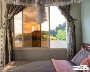 En eller flere senge i et værelse på Mohéli Vanilla Lodge