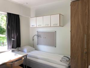 Postel nebo postele na pokoji v ubytování Sund sommerhotell, Inderøy