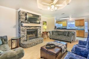 a living room with a fireplace and a tv at Blue Ridge Vacation Rental with Game Room! in Blue Ridge