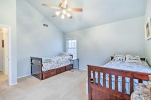 a bedroom with two beds and a ceiling fan at Blue Ridge Vacation Rental with Game Room! in Blue Ridge