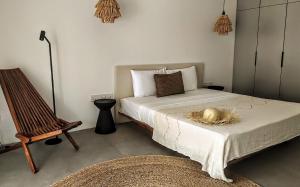 a bedroom with a bed with a basket on it at Coco Villa in Thoddoo