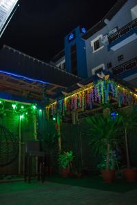 a string of lights hanging from a building at night at Go2Hotel45 in Lagos