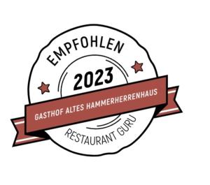 un logo para el equipo de campeonato del equipo de lucha americano en Gasthof Altes Hammerherrenhaus, en Übelbach