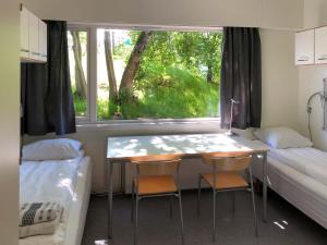 Postel nebo postele na pokoji v ubytování Sund sommerhotell, Inderøy + 6 fotografií