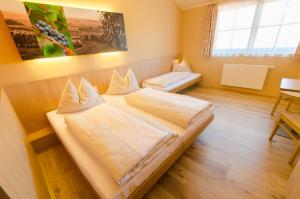 Postel nebo postele na pokoji v ubytování JUFA Hotel Neutal