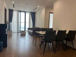 a room with a table and chairs and a couch at Vinhomes Sky Lake Phạm Hùng View Keangnam in Hanoi +104 photos