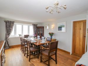 a dining room with a table and chairs at Fairview House in Kidderminster