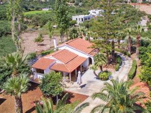 an aerial view of a house with palm trees at Gal House in Balíon