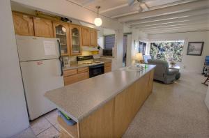 a kitchen with a refrigerator and a counter top at Village Pleasure condo in Stateline