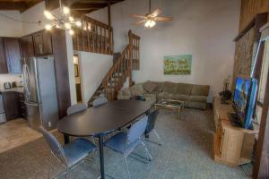 a kitchen and living room with a table and a couch at Tahoe Olympic condo in Stateline