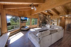 a large living room with a couch and a fireplace at The Heights home in Zephyr Cove