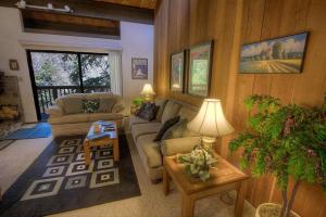 a living room with a couch and a table at Forest View Townhouse home in Kings Beach +30 photos