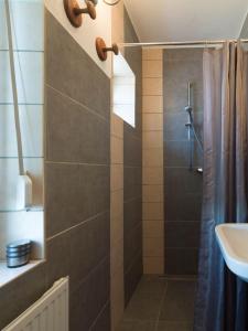 a bathroom with a shower and a sink at Müllers WohnRäume in Saarlouis