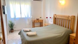 Postel nebo postele na pokoji v ubytování Hostal Sango Sierra de las Nieves