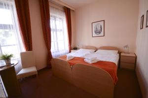 Postel nebo postele na pokoji v ubytování Hotel Paradies