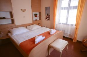 Postel nebo postele na pokoji v ubytování Hotel Paradies