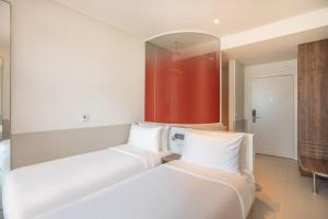 Postel nebo postele na pokoji v ubytování Wink Hotel Saigon Centre - 24hrs Lifestyle Stay