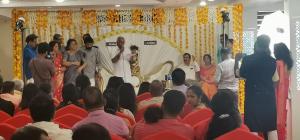 a group of people in an auditorium with a man speaking to a crowd at HOTEL PANKAJ RESIDENCY in Guruvāyūr