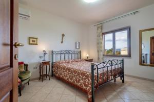Postel nebo postele na pokoji v ubytování Villa Pitti